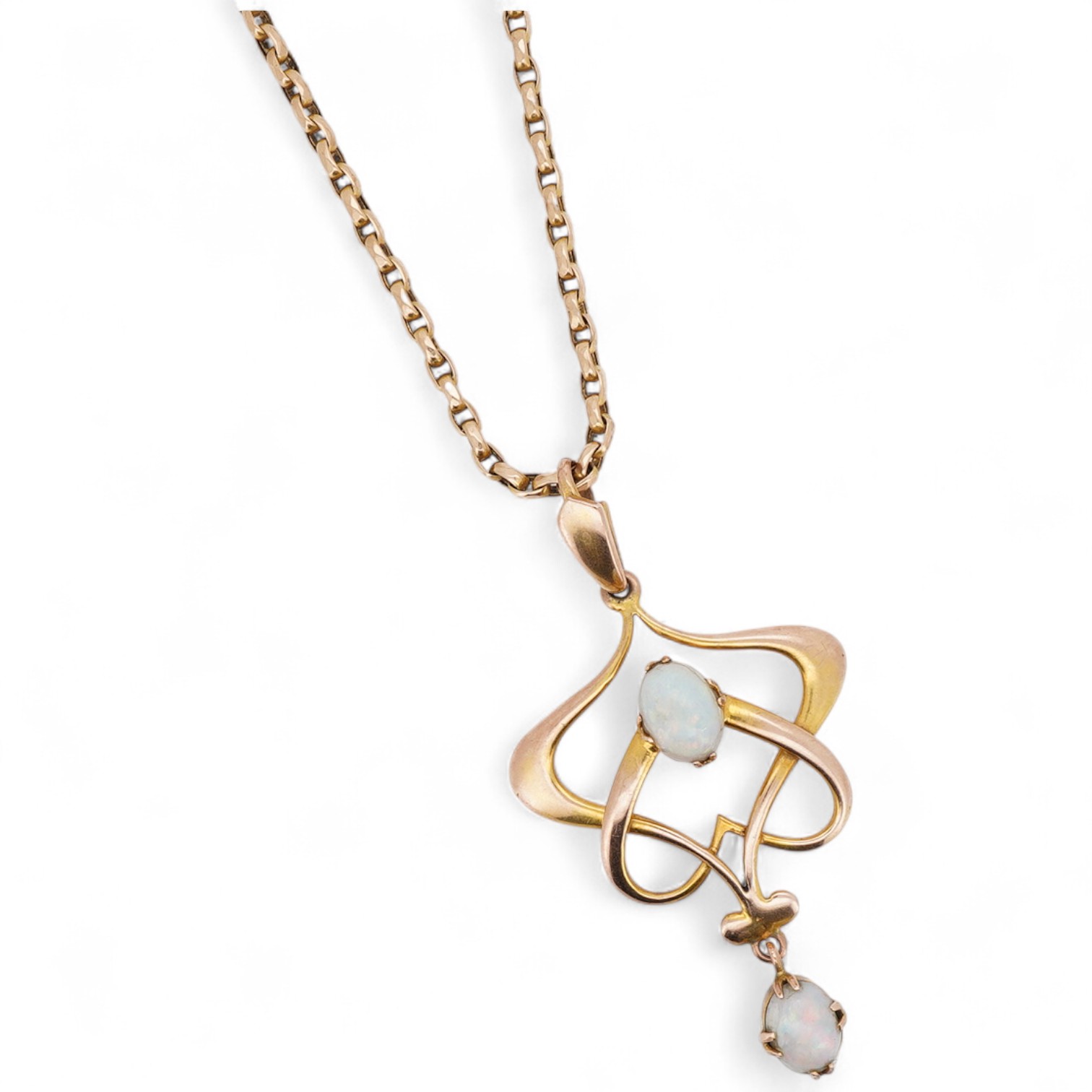 An Art Nouveau gold and opal pendant and chain, early 20th century, the pendant of sinuous design, set with two cabochon opals, to a gold belcher link chain necklace, chain length 45cm, stamped 15ct, pendant 4.7cm, stamp
